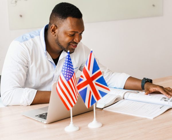 black-handsome-translator-uses-his-laptop-online-work-according-social-distancing
