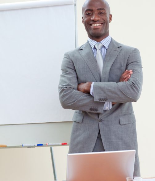 confident-ethnic-businessman-office-with-folded-arms